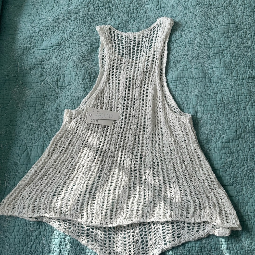 White sleeveless crocheted sweater top